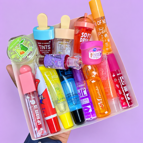 15-piece lip gloss and lip care bundle on a pastel lilac background