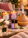 Aromatherapy Stress Free Set with two scented candles, two essential oils, reed diffuser and humidifier in a cozy home setting